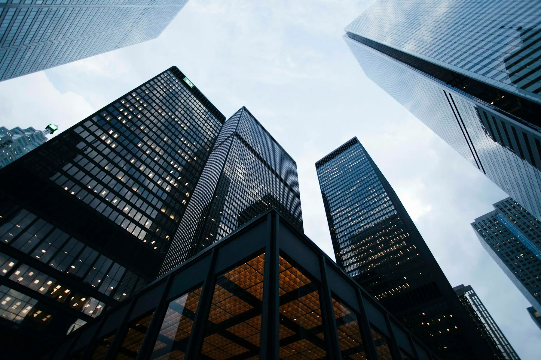 Glass towers rising into an open sky